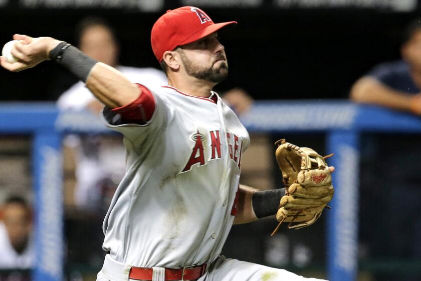 Angels third baseman Kaleb Cowart throws to second base to force out the Indians' Lonnie Chisenhall during a game in Cleveland on Aug. 28. 2015.