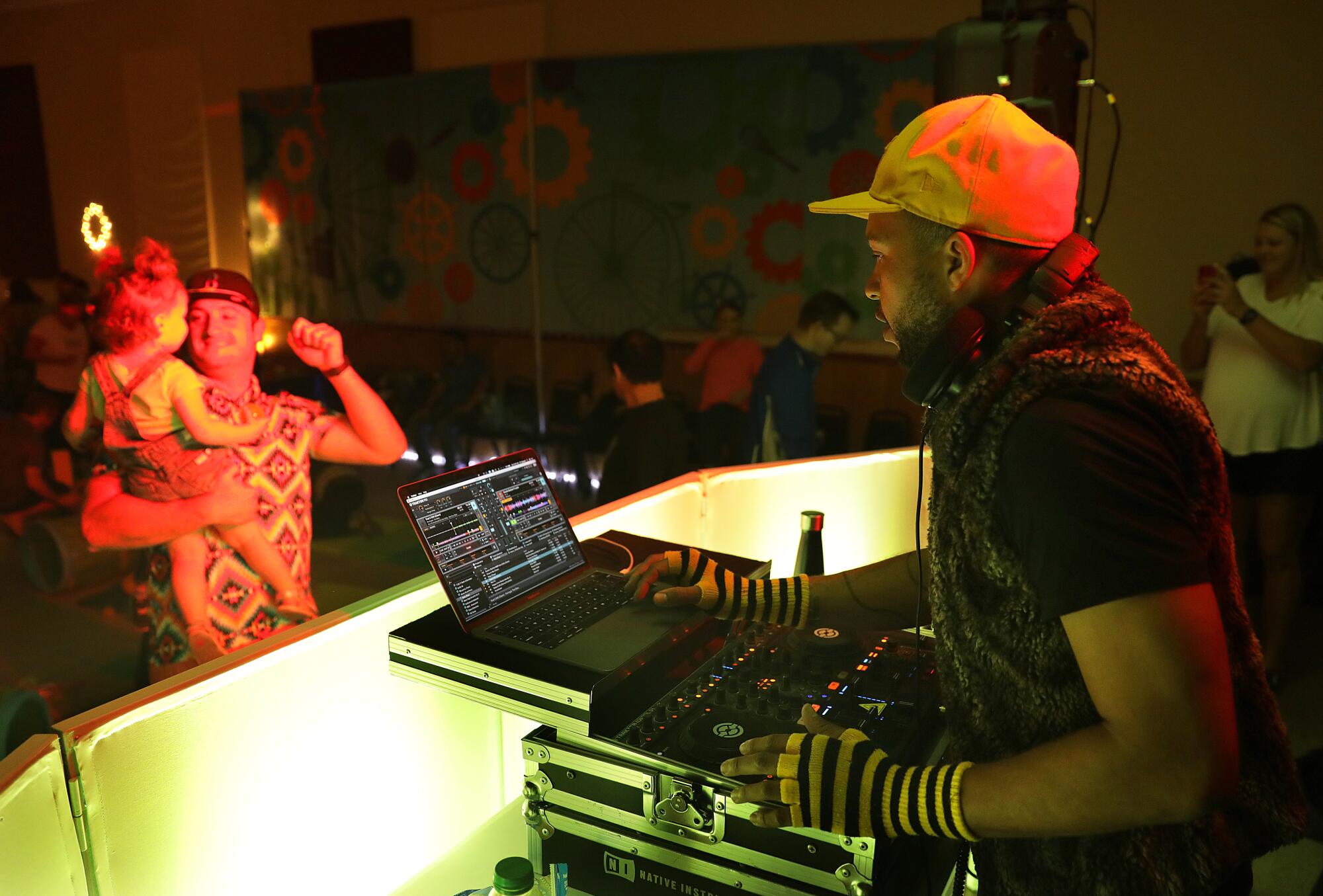 Edward Hazzard, a.k.a. DJ E.T., provides the music at the Baby Raves.