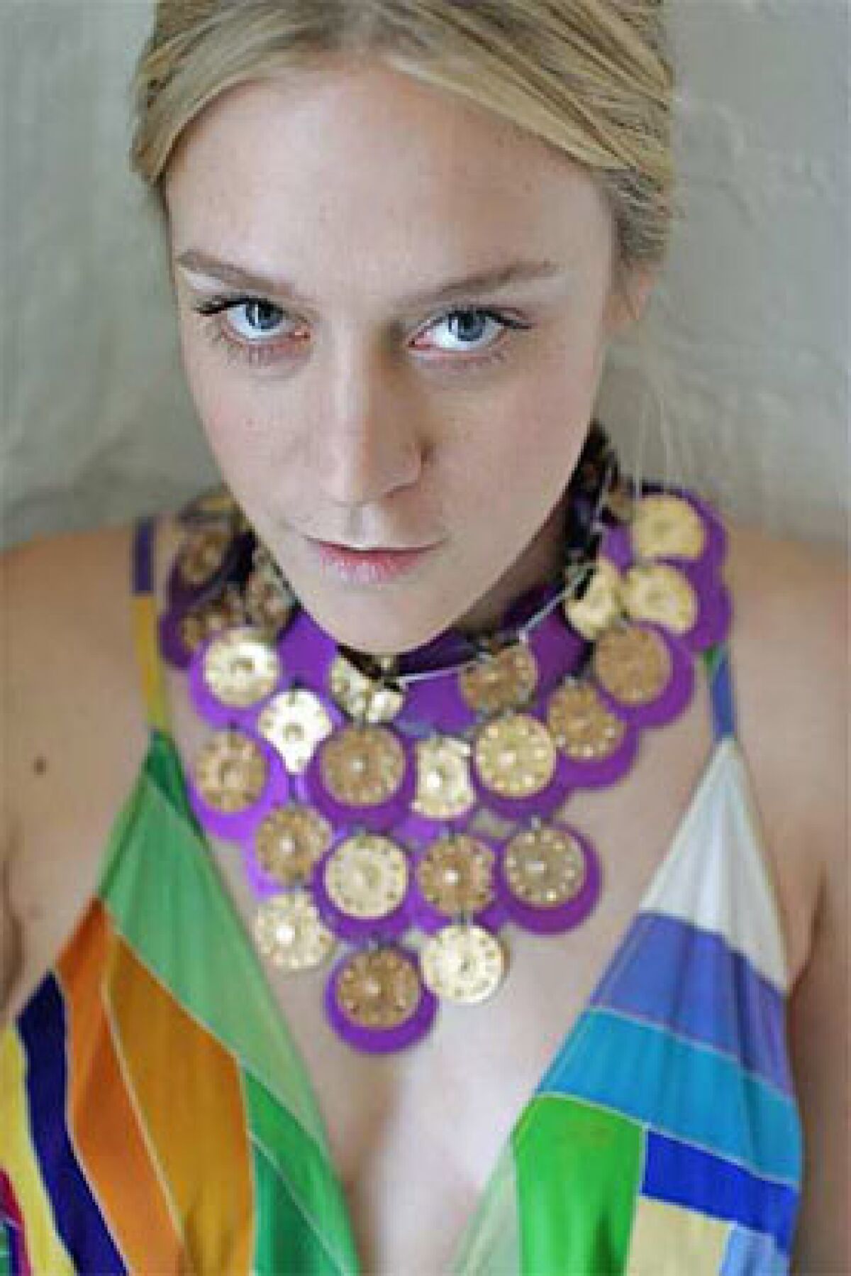 Sevigny wears a Paco Rabanne Haute Couture dress and collar.