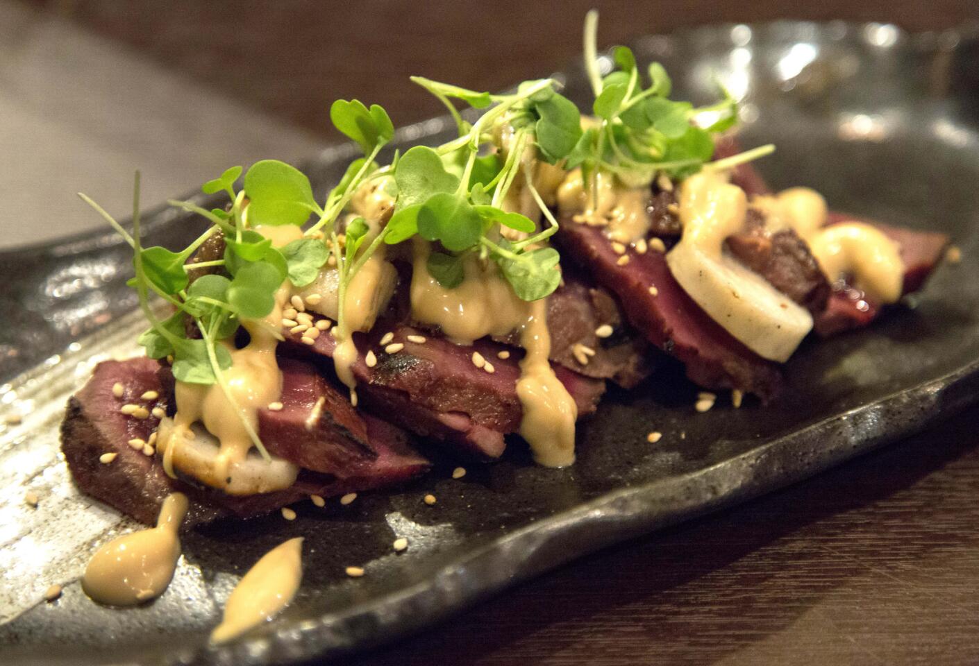 Grilled miso heart served with king oyster mushrooms and yuzi miso vinaigrette.