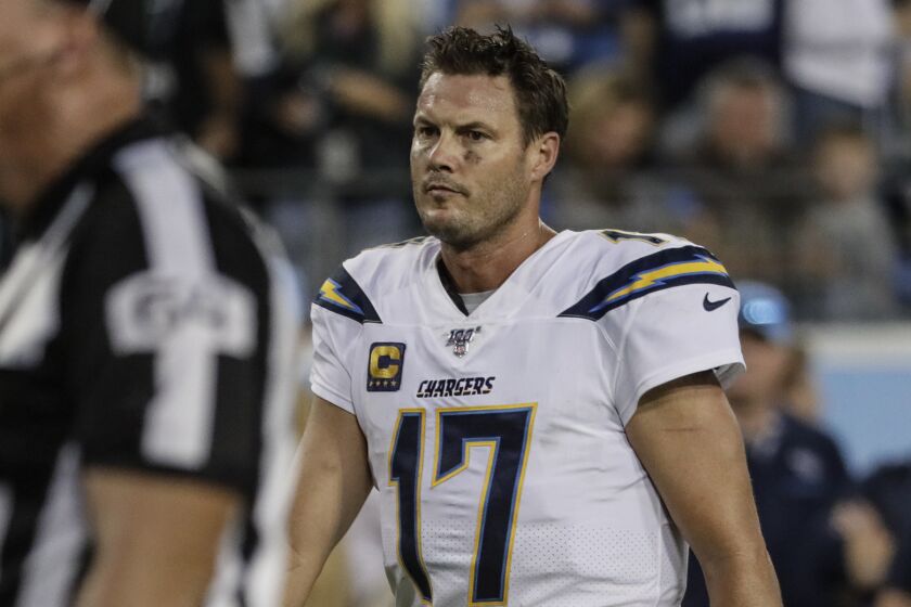NASHVILLE, TN, SUNDAY, OCTOBER 20, 2019 - Dejected and weary, Los Angeles Chargers quarterback Philip Rivers (17) heads to congratulate Titans players in the last seconds of a 26-23 loss at Nissan Stadium. (Robert Gauthier/Los Angeles Times)