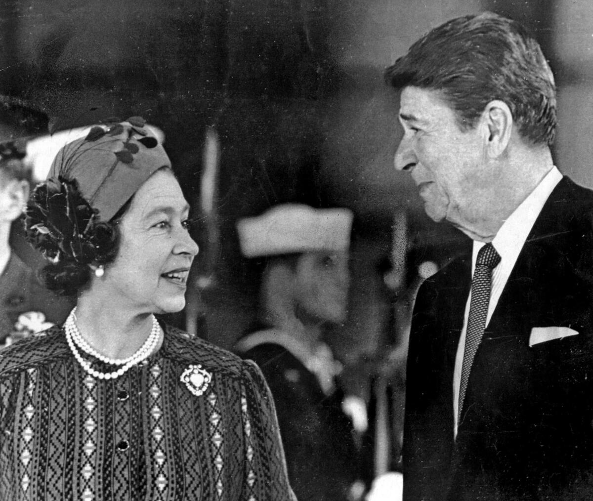 Queen Elizabeth II and President Reagan chat in 1983. 