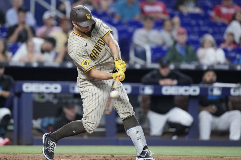 San Diego Padres' Gary Sanchez hits a home run during the fifth inning of a baseball game against the Miami Marlins, Thursday, June 1, 2023, in Miami. (AP Photo/Wilfredo Lee)