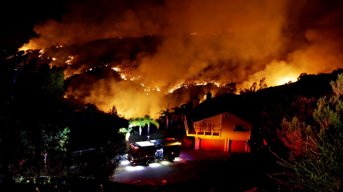 A hillside burns Wednesday night in San Marcos as seen from Coronada Hills Drive.
