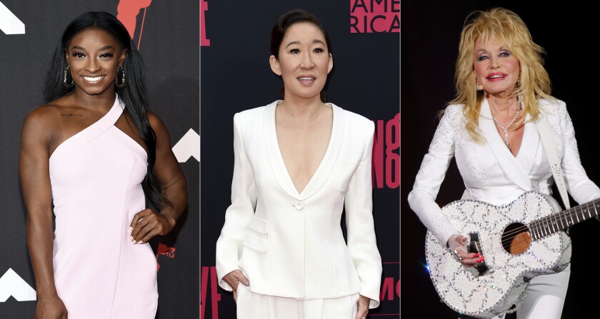 Olympic gymnast Simone Biles appears at the MTV Video Music Awards in New York on Sept. 12, 2021, left, actor Sandra Oh appears at the season two premiere of "Killing Eve" in Los Angeles on April 1, 2019, center, and Dolly Parton appears in concert in Nashville, Tenn., on July 31, 2015. People magazine has named Biles, Oh, Parton and the nation's teachers as its “People of the Year.” (AP Photo)