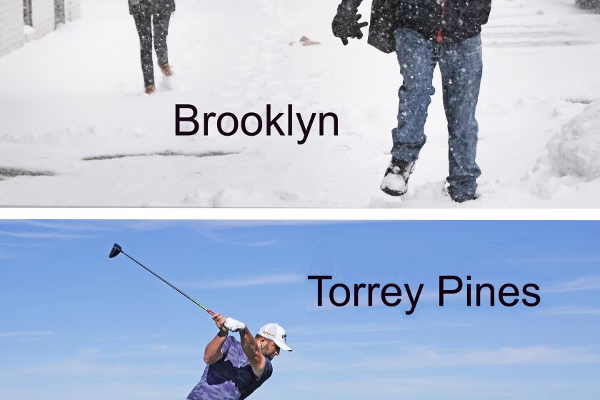 People walk through Brooklyn as a winter storm brings heavy snow, freezing temperatures and blowing winds to the area on Jan. 29. Meanwhile, sunny skies were in San Diego that same week for the Farmers Insurance Open at Torrey Pines.