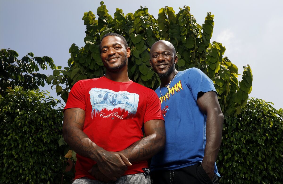 Joshua McKinney, 26, left, and Eric Hunt, 41, at Joshua's grandmother's home in Los Angeles.