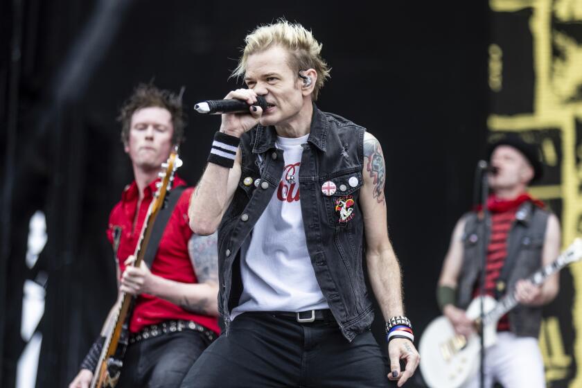 Deryck Whibley sings in white cutoff and denim vest during the 2024 Sonic Temple Art and Music Festival in Columbus, Ohio