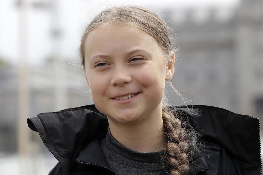 FILE - In this Aug. 14, 2019 file photo, Climate change activist Greta Thunberg addresses the media during a news conference in Plymouth, England. Thunberg has crossed the Atlantic on a zero-emissions sailboat to attend a conference on global warming. On Wednesday, Aug. 28, before dawn, Thunberg tweeted, "Land!! The lights of Long Island and New York City ahead." (AP Photo/Kirsty Wigglesworth)