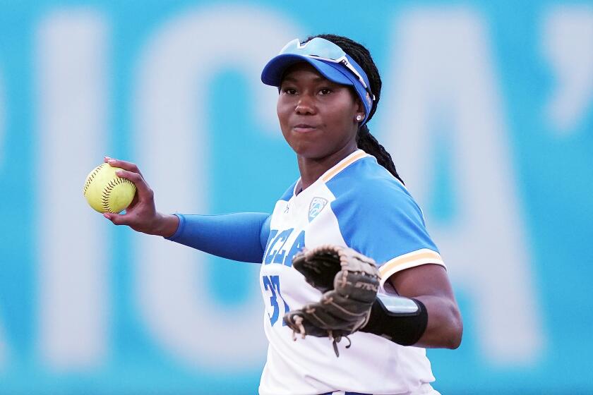 UCLA's Kinsley Washington fields the ball during an NCAA softball game against Alabama on Friday, Feb 14, 2020, in Clearwater, Fla. (AP Photo/Vera Nieuwenhuis)