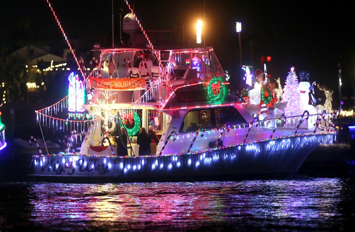 A very colorful pleasure cruiser moves along the route during the 111th Newport Beach Christmas Boat Parade.