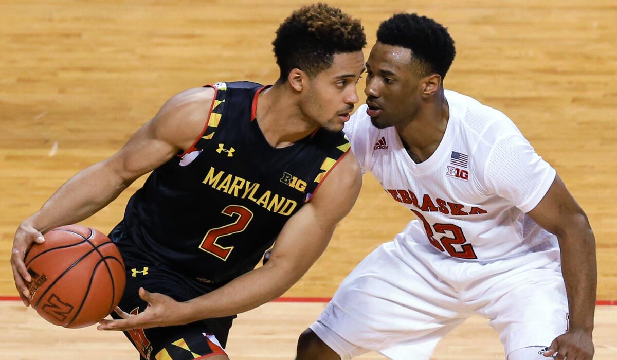 Maryland's Melo Trimble, left, tries to get around Nebraska's Benny Parker during the second half on Wednesday.