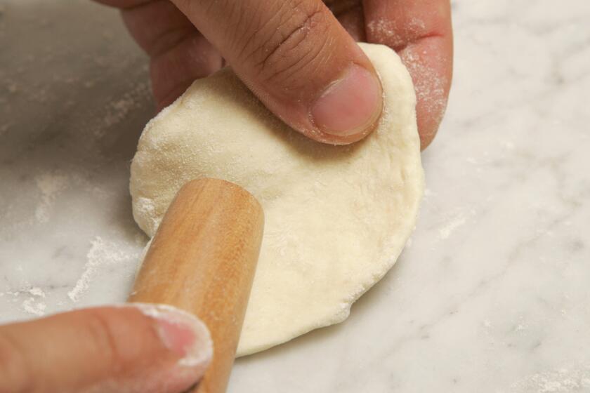 Make a circle, thinner at the edges and thicker in the center, with a small, tapered rolling pin.
