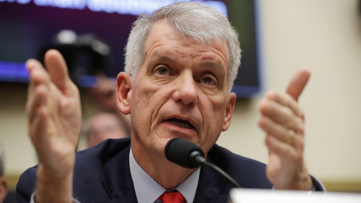 Compensation for Wells Fargo CEO Timothy Sloan, shown testifying March 12 before Congress, includes a $2 million "incentive award."