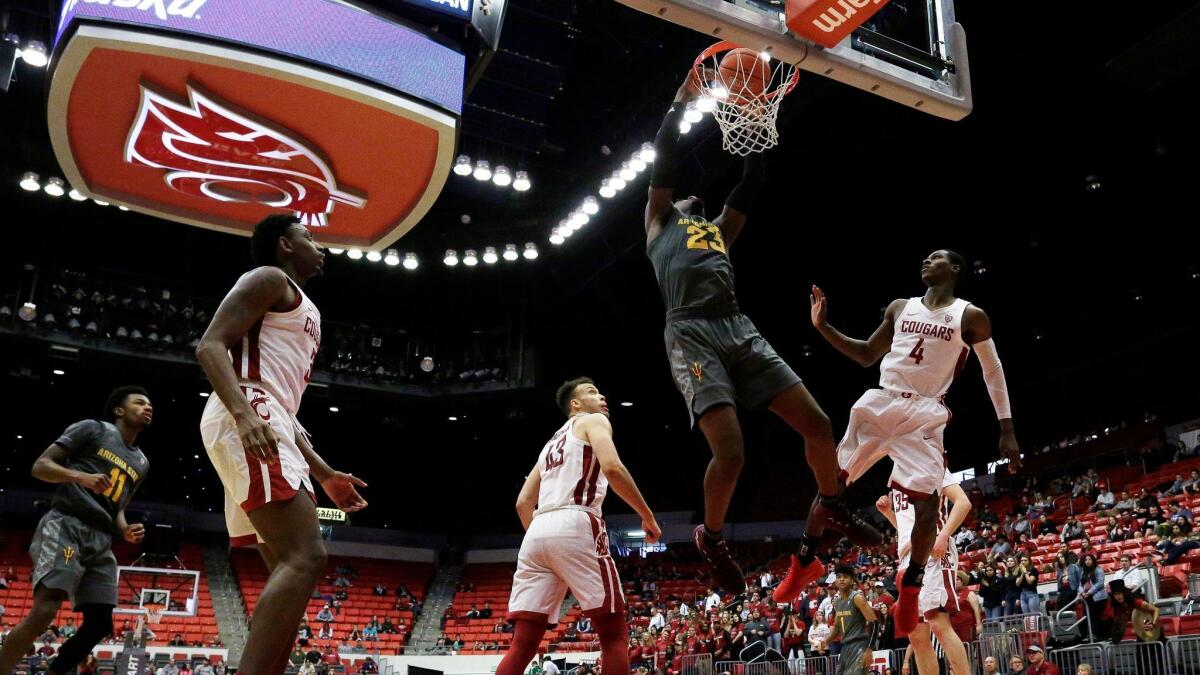 Arizona State forward Romello White (23) dunks during the second half of an NCAA college basketball game against Washington State in Pullman, Wash., Sunday, Feb. 4, 2018. (AP Photo/Young Kwak)