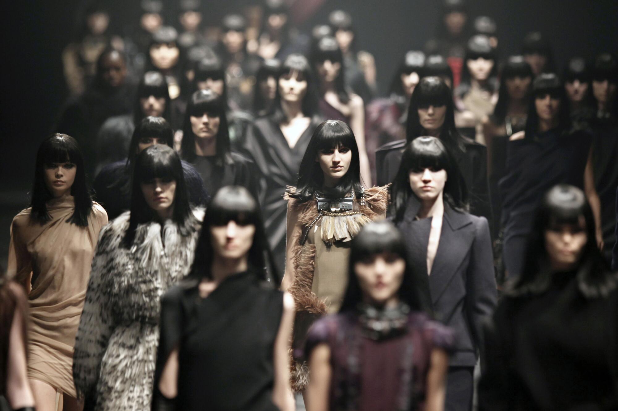 A crowd of models at a fashion show.