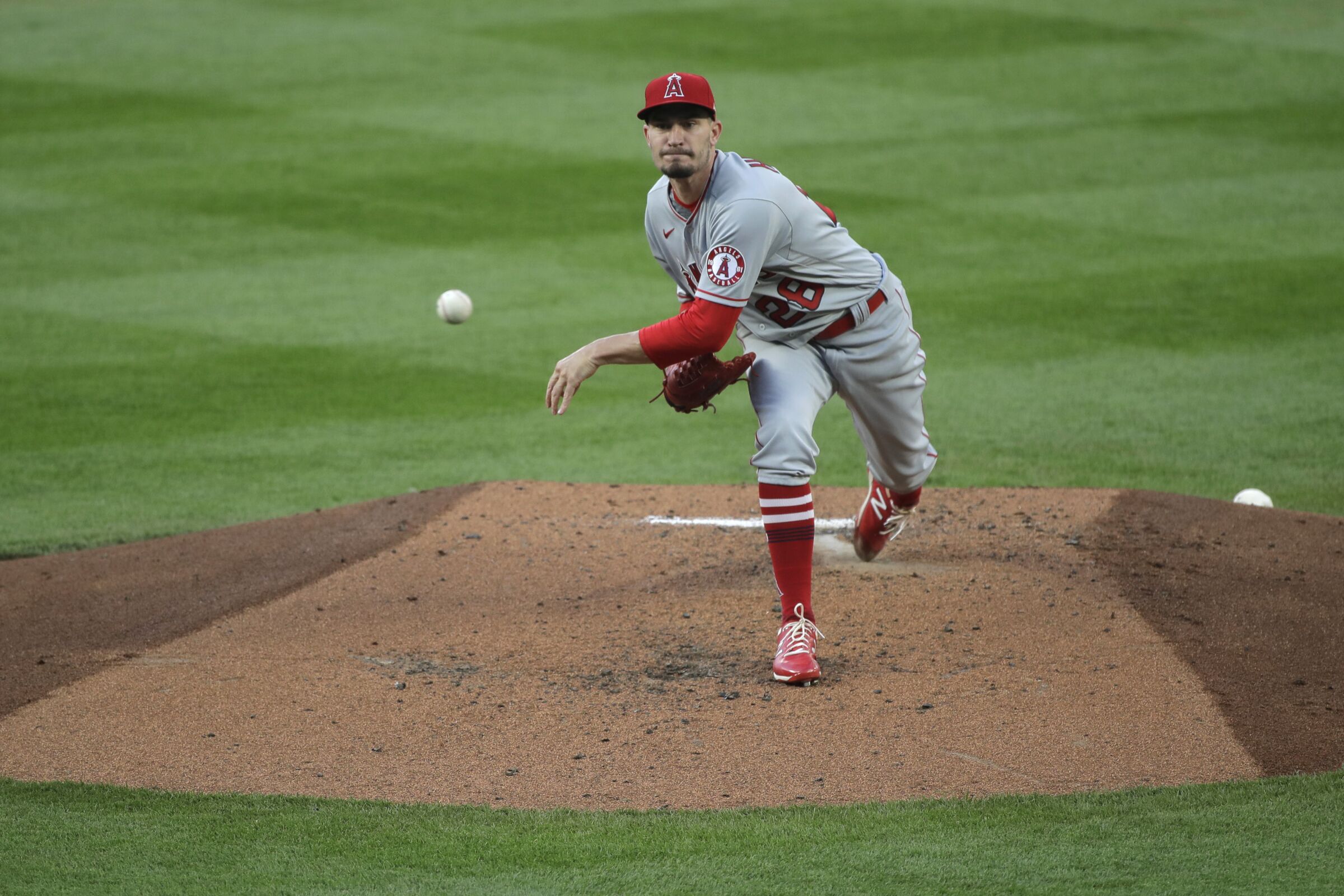 Los Angeles Angels starting pitcher Andrew Heaney throws to a Seattle Mariners batter.