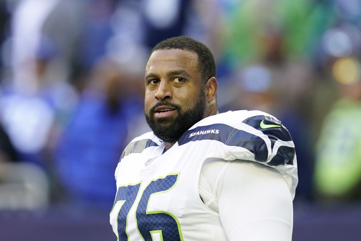 FILE - Seattle Seahawks offensive lineman Duane Brown (76) looks on during pregame warmups before an NFL football game against the Houston Texans on Dec. 12, 2021, in Houston. The New York Jets and offensive tackle Duane Brown agreed to terms on a two-year contract on Thursday, Aug. 11, 2022, a person with direct knowledge of the deal told The Associated Press. (AP Photo/Matt Patterson, File)