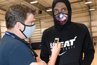 Times reporter Dan Woike interviews Heat star Jimmy Butler during a practice.