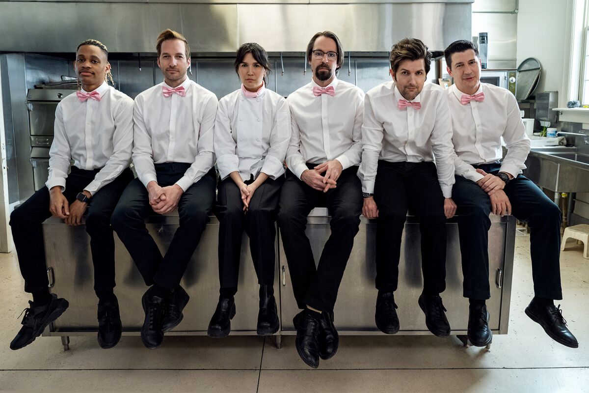 These pink-bowtied cater-waiters are the cast of sitcom "Party Down," back for a third season 13 years after being canceled.