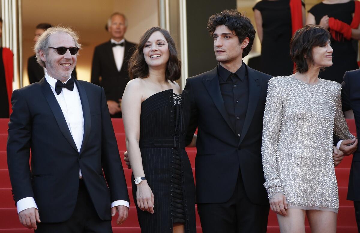 French director Arnaud Desplechin, left, with actors Marion Cotillard, Louis Garrel and Charlotte Gainsbourg arriving for the opening gala screening of "Ismael's Ghosts (Les Fantomes d'Ismael)" at the 70th annual Cannes Film Festival. MORE PHOTOS
