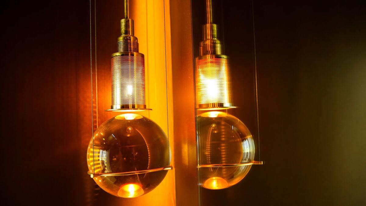 Postmodern pendant lamps by Günhter Leuchtmann hang in the powder room. (Jay L. Clendenin / Los Angeles Times)