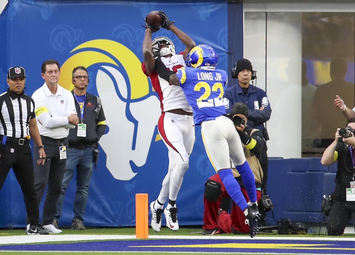 Cardinals receiver A.J. Green catches a touchdown pass against Rams defensive back David Long in the second quarter.