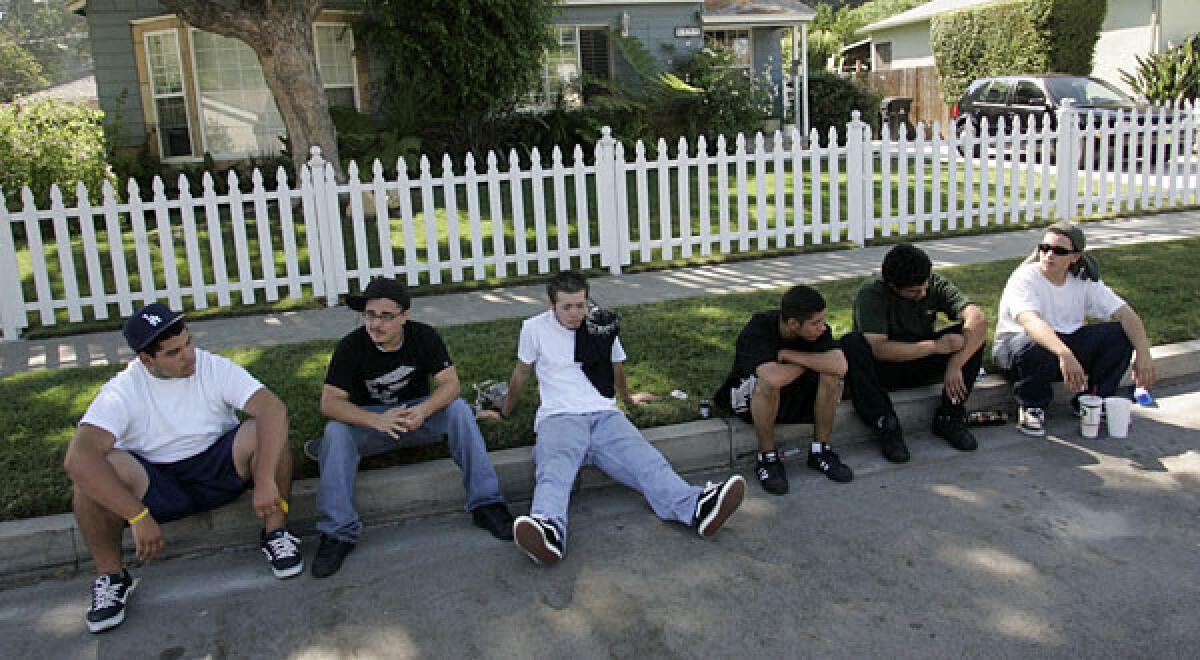 Left to right, Polo Morales, Mark Cevallos, Elias Fuentes, Andy Hurtarte, Gus Andrade and Isaac Castillo hang out infront of Morales' home in Van Nuys.