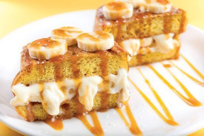 Among the new menu items at Broken Yolk is the Stuffed French Toast, which is served with bananas, mascarpone cheese and drizzled with caramel. Courtesy Photo