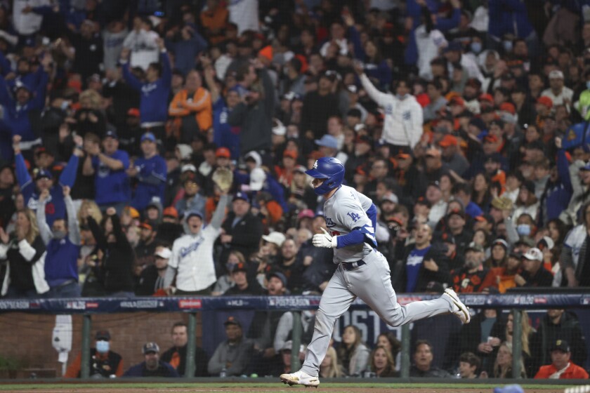 The Dodgers' Will Smith rounds the bases on a solo home run during the eighth inning Oct. 9, 2021.