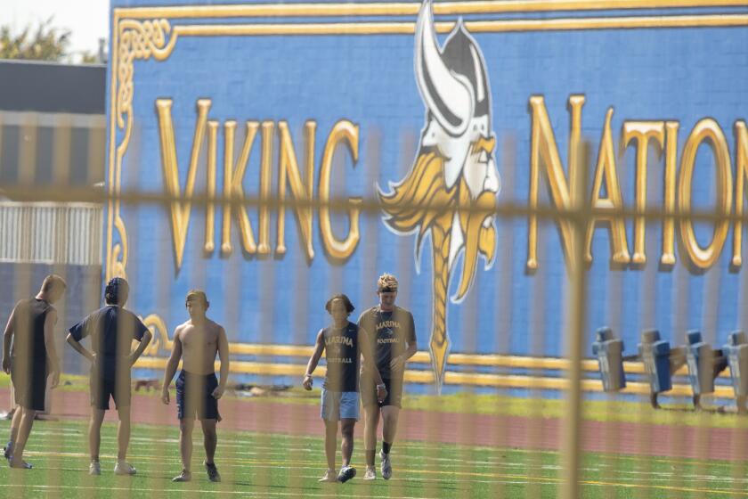 Marina High School athletes work out on campus on Tuesday, August 25.