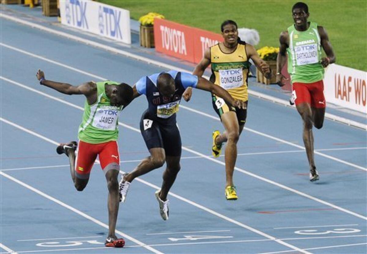 Grenada's Kirani James, left, crosses the finish line ahead of USA's LaShawn Merritt, second from left, Jamaica's Jermaine Gonzales, second from right, and Grenada's Rondell Bartholomew in the Men's 400m final at the World Athletics Championships in Daegu, South Korea, Tuesday, Aug. 30, 2011. (AP Photo/Martin Meissner)