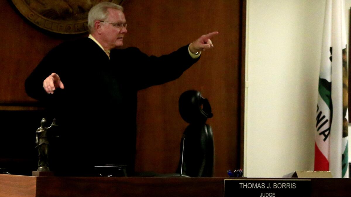 Judge Thomas Borris, seen in February 2014 in his Westminster courtroom, has been examining recalled cases amid a probe into apparent fraud involving Orange County court records.
