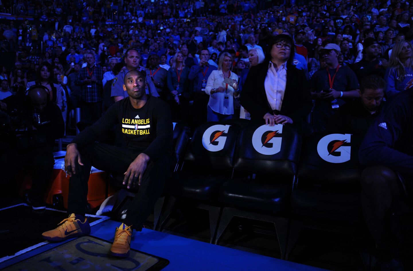 Kobe Bryant watches introductions from the bench before a game against the Thunder in Oklahoma City on April 11.