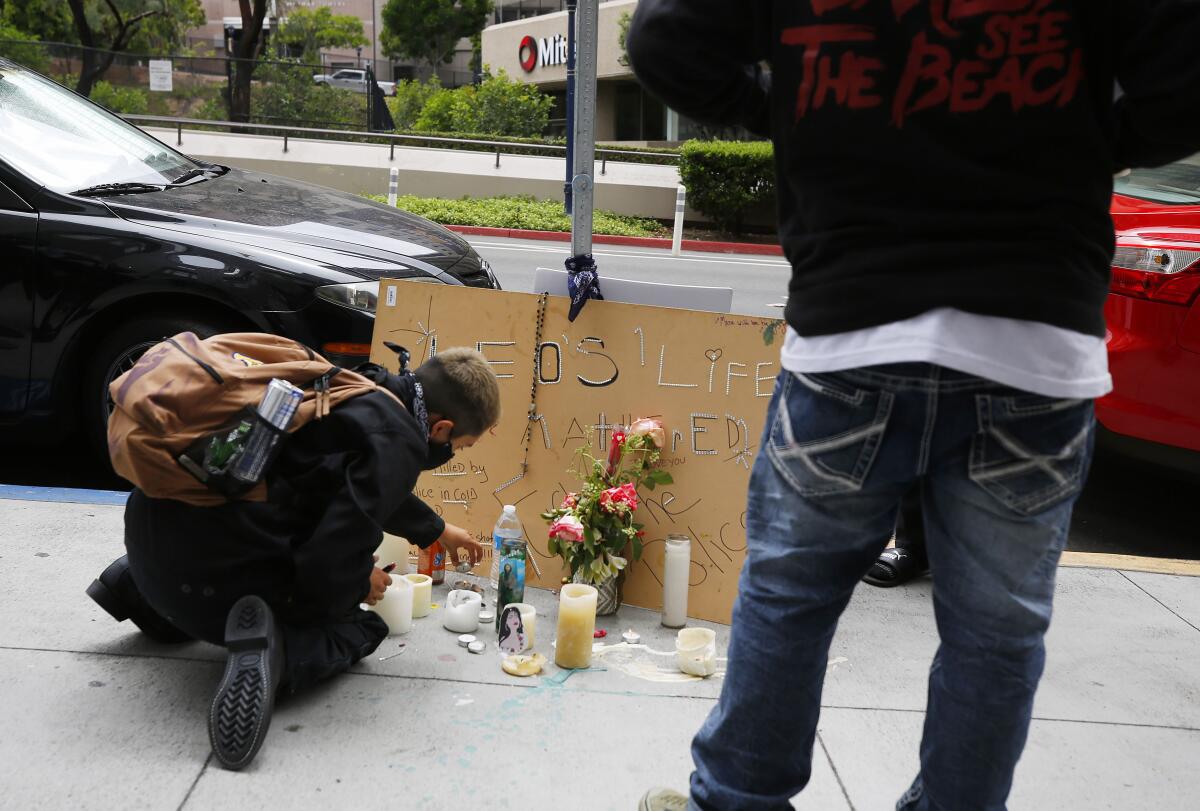 Candles were arranged where Leonardo Ibarra, 25, was shot by San Diego police on Sixth Avenue near A Street on June 27.