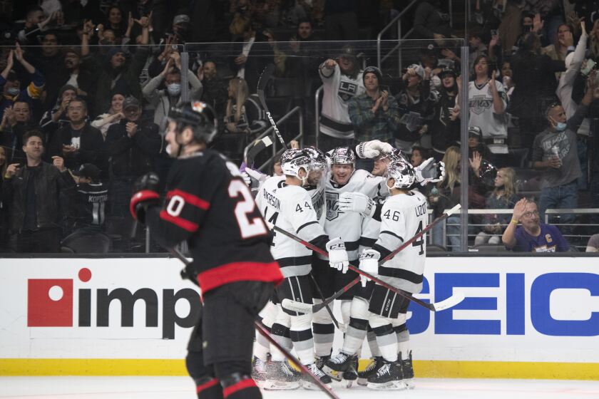 Los Angeles Kings celebrate a goal by left wing Arthur Kaliyev (34) in the second period of an NHL hockey game against the Ottawa Senators Saturday, Nov. 27, 2021, in Los Angeles. (AP Photo/Kyusung Gong)