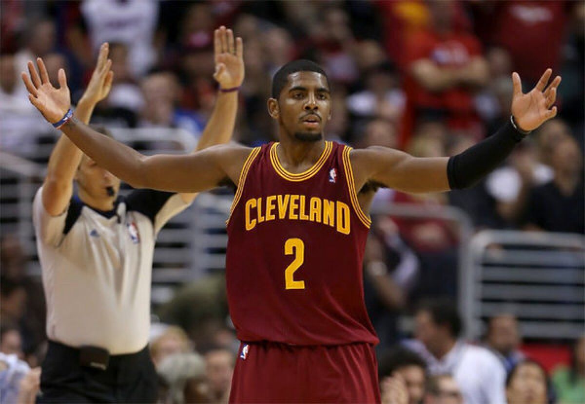 Kyrie Irving celebrates after hitting a three-point shot that sealed a win for Cleveland.