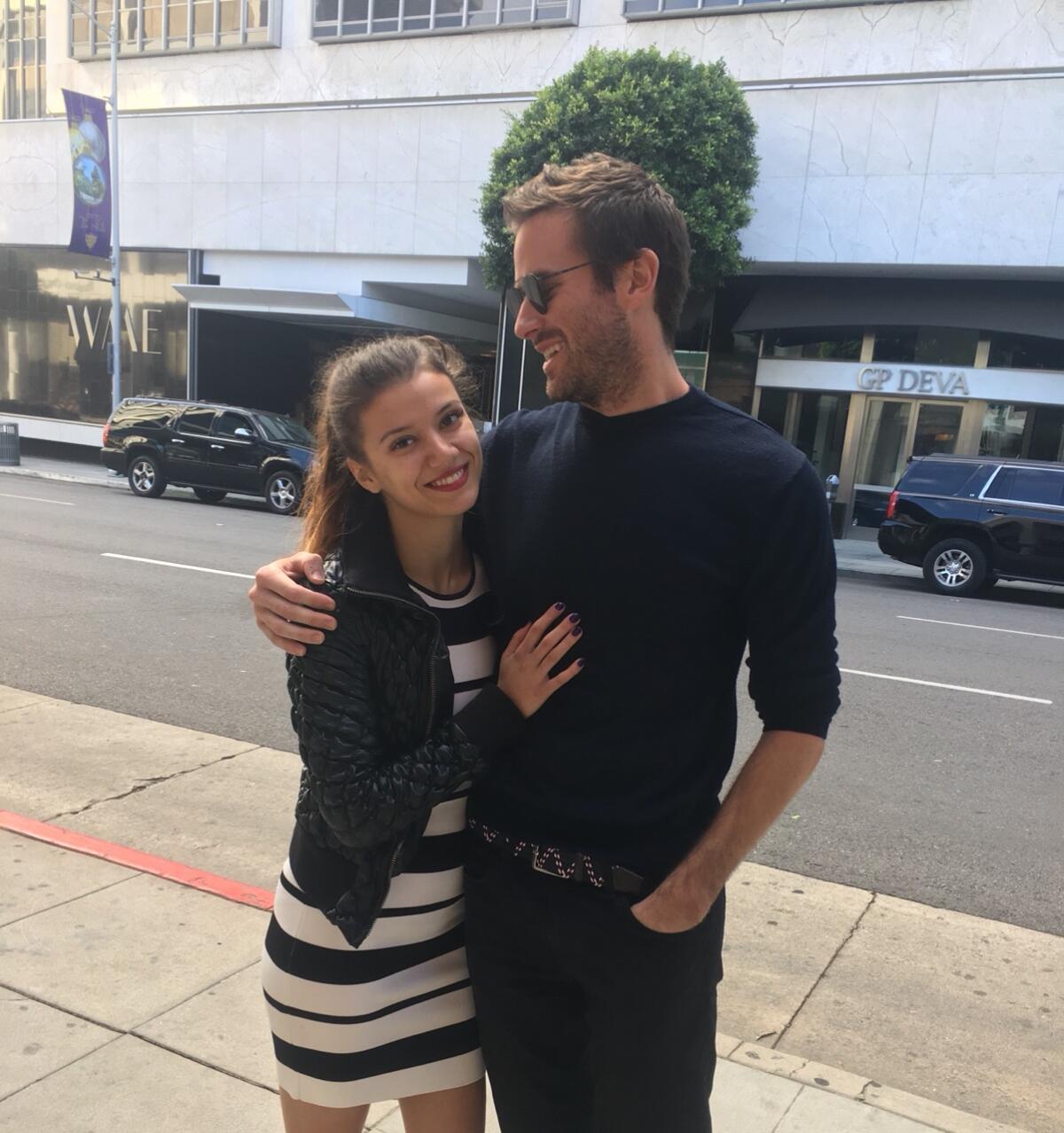Effie, who claims Armie Hammer raped in her in 2017, with the actor.