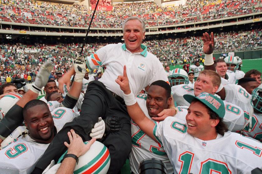 FILE - In this Nov. 14, 1993, file photo, Miami Dolphins coach Don Shula is carried on his team's shoulders after his 325th victory, against the Philadelphia Eagles in Philadelphia. Shula, who won the most games of any NFL coach and led the Miami Dolphins to the only perfect season in league history, died Monday, May 4, 2020, at his South Florida home, the team said. He was 90. (AP Photo/ George Widman)