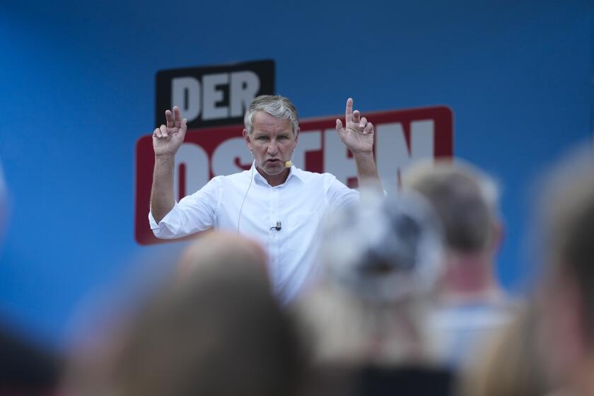 Bjoern Hoecke, top candidate of the far-right Alternative for Germany party, or AfD, speaks on an election campaign rally of the party for upcoming state elections in Suhl, Germany, Tuesday, Aug. 13, 2024. In the federal state Thuringia, in former East Germany, the citizens are called to vote for a new state parliament on Sept. 1, 2024. (AP Photo/Markus Schreiber)