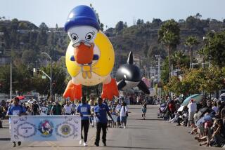The Mother Goose balloon, navigated by the Girl Scouts makes its way down Main St. during the 73rd annual Mother Goose Parade in El Cajon on Nov. 24, 2019.