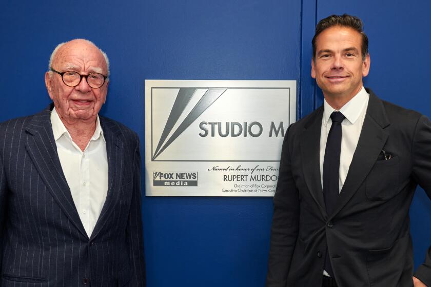 Rupert Murdoch, pictured with his son, Lachlan Murdoch, in 2021.
