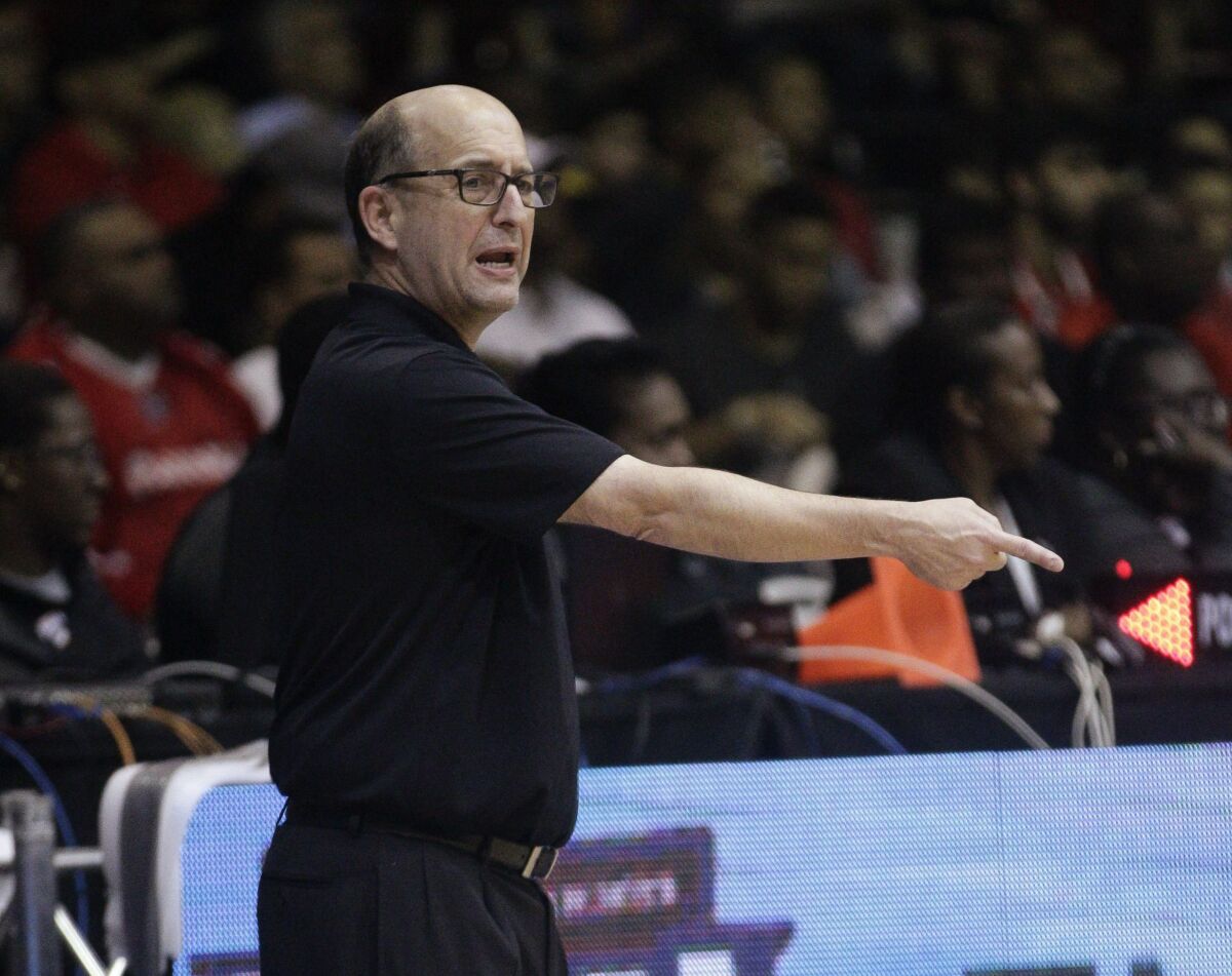 Jeff Van Gundy coaches from the sidelines.