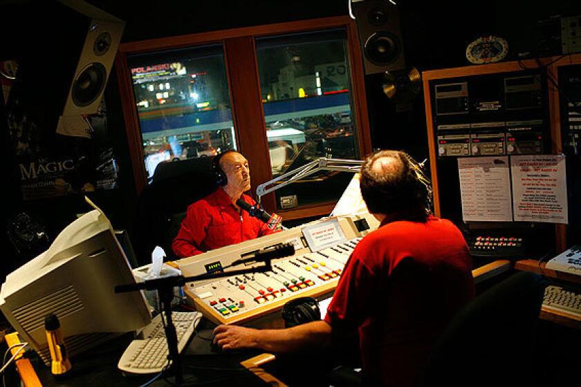 Radio legend Art Laboe, left, and producer Tom Peniston inside Laboe's Hollywood studio. His show ranks near the top in its evening time slot, according to Arbitron ratings, and is popular among listeners 25 to 54 years old.