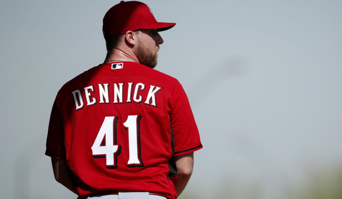 Ryan Dennick prepares to throw a pitch during a spring training workout with the Cincinnati Reds on Feb. 19 in Goodyear, Ariz.