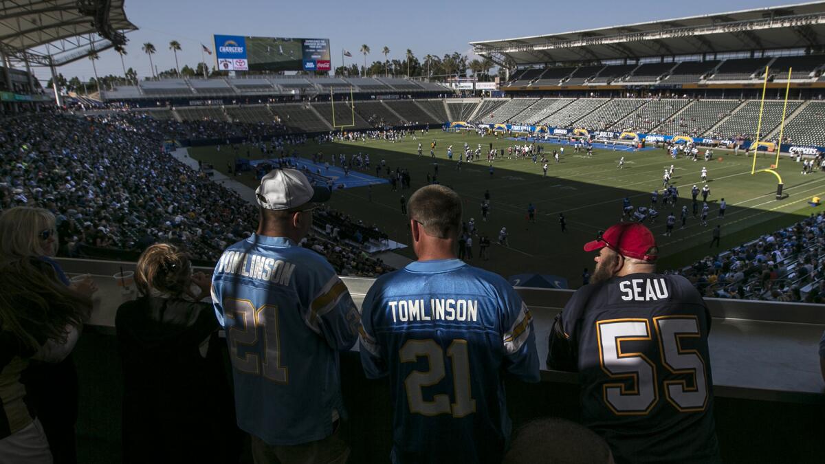 Chargers fans watch on a terrace overlooking the southwest end of the field as the Bolts practice at StubHub Center.