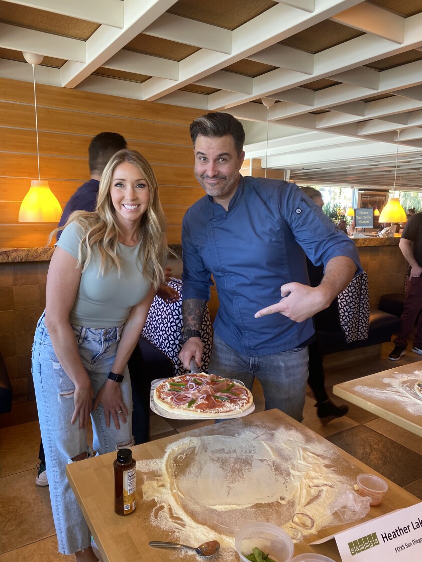 Fox5 San Diego's Heather Lake and her award-winning hot honey pizza with Sammy's Food + Wine executive chef Alfie Szeprethy.