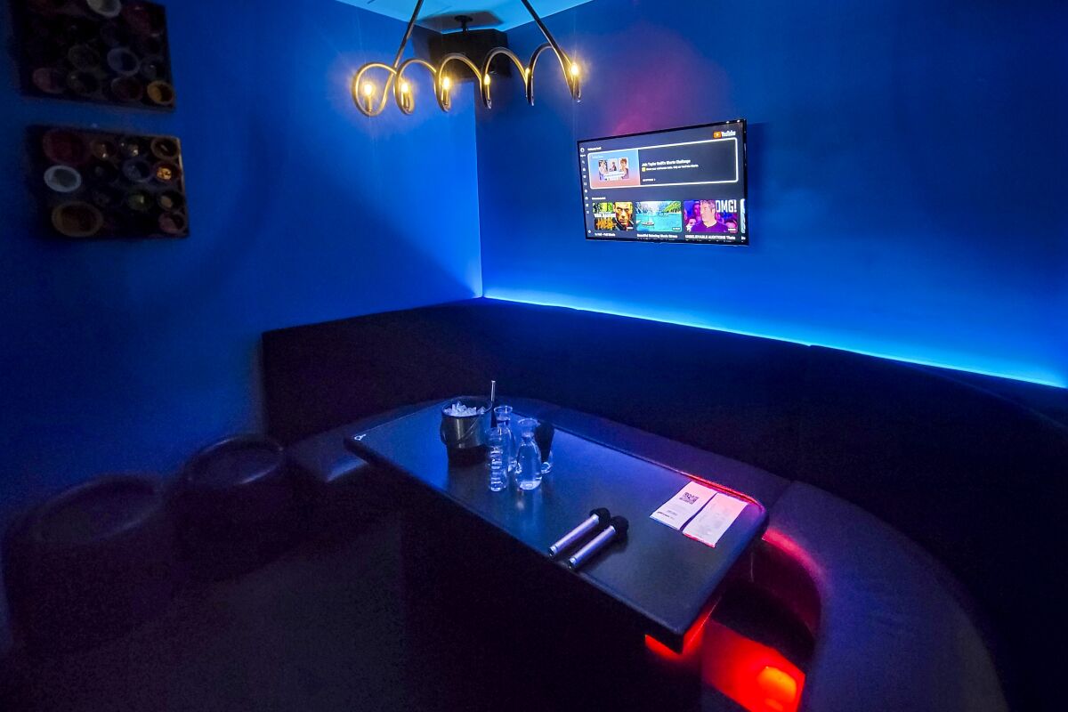 A dimly lit karaoke room at the Venue 