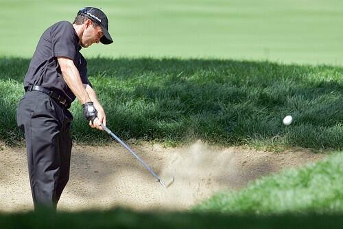 Mike Weir hits from a bunker on the fifth hole during the final round.