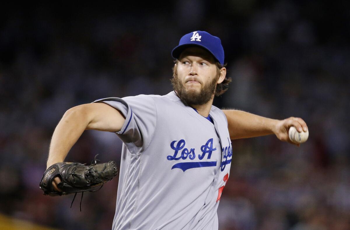 Dodgers starting pitcher Clayton Kershaw throws a pitch against the Diamondbacks during the first inning.